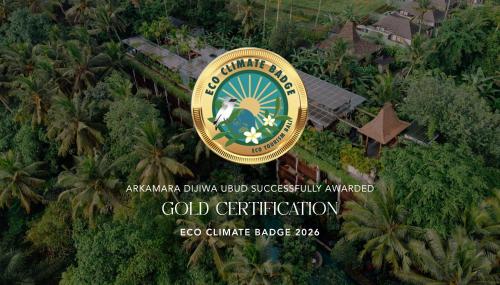 a sign for a hotel in the middle of a forest at Arkamara Dijiwa Ubud in Ubud