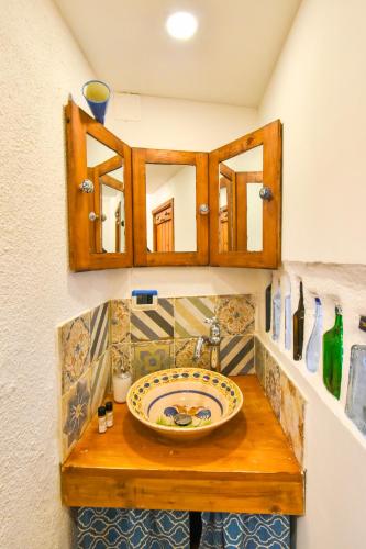 a bathroom with a sink and a mirror at Finisterre Casa di mare - Housea in Polignano a Mare