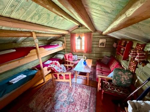 a room with a bed and a couch in a house at Ringen Camping in Vestre Gausdal