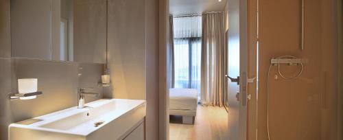 a bathroom with a sink and a mirror at Trogir SkyView Suites in Trogir