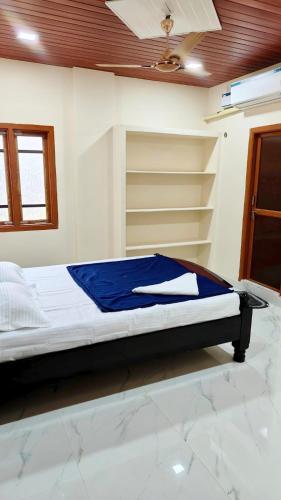 a bedroom with a bed in a room at Dove Convention in Machilīpatnam