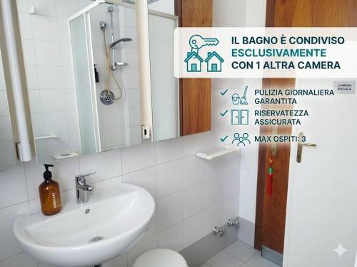 a bathroom with a sink and a mirror at B&B Signora Minù in Perugia