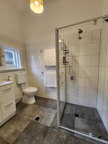 a bathroom with a shower and a toilet at Entire Unit in Brooklyn Park in West Richmond