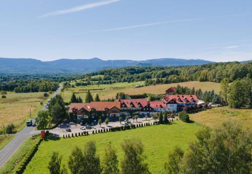 an aerial view of a resort with a large building at Hotel Chata Za Wsią in Mysłakowice