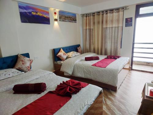 a bedroom with two beds with bows on them at grace homestay in Darjeeling