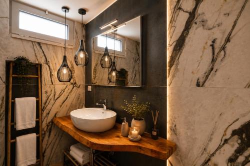 a bathroom with a sink and a mirror at Yellow Apartment in Bari