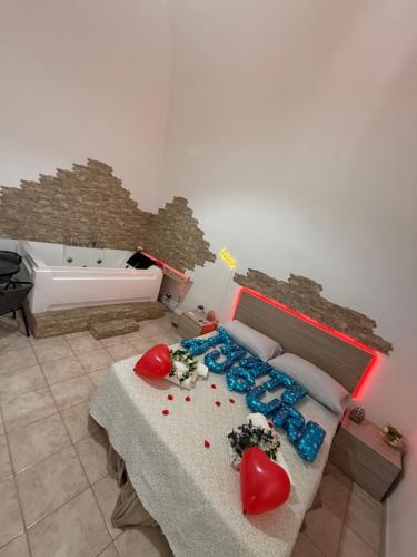 a bedroom with a bed and a bath tub at Dolce Notte in Taranto