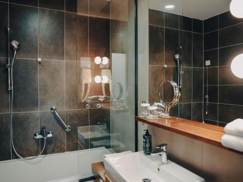 a bathroom with a shower and a sink at ibis Styles Sarajevo in Sarajevo