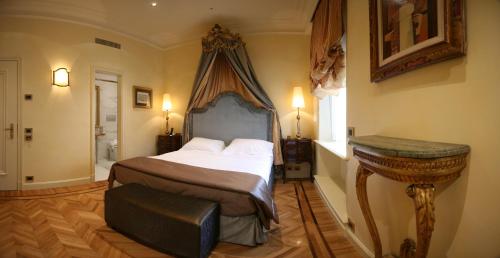 Postel nebo postele na pokoji v ubytování Hotel Villa Duse