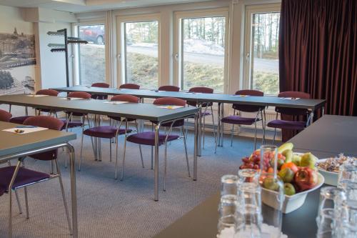 a row of tables and chairs in a room at Best Western Plus Park Airport Hotel in Arlanda