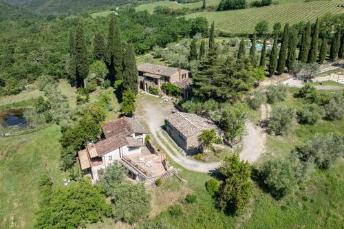 an aerial view of a mansion with trees at Podere le Lune with Pool, San Gimignano in San Gimignano