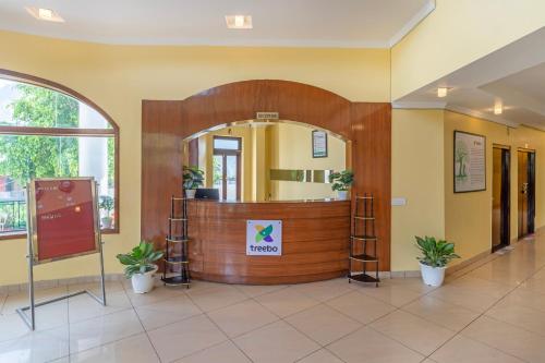 a lobby with a large mirror in a building at Treebo Kaler Hotel & Resorts in Nainital