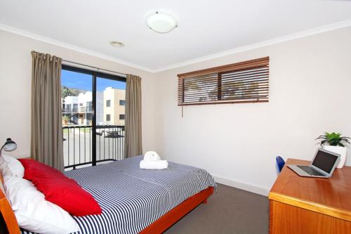 Katil atau katil-katil dalam bilik di Amberoo Apartments Tamworth