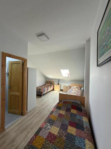 a room with a bed and a couch and a rug at Cazare Turnisor in Sibiu