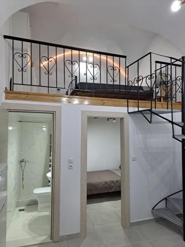 a room with a bunk bed with a toilet at Patasa holiday apartment in Pyrgi