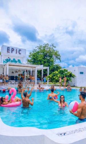 a group of people in the swimming pool at a resort at Epic Wild Wilpattu in Nochchiyagama