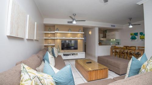 a living room with a couch and a table at D3 Sea Lodge - by Stay in Umhlanga in Durban