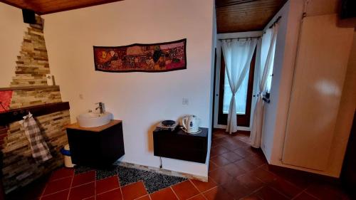 a bathroom with a sink and a mirror on the wall at Ca'Neggio in Neggio
