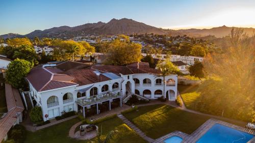 an aerial view of a house with a yard at Mountain View International Hotel - Eswatini in Mbabane