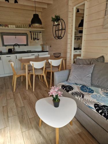 a living room with a couch and a table at LABALAND in Gąski