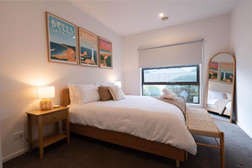 a bedroom with a large bed and a window at Shell Escape at Ocean Grove in Ocean Grove
