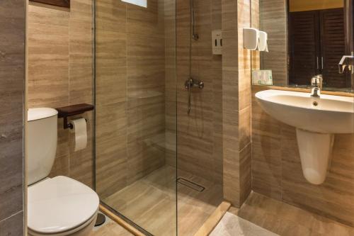 a bathroom with a toilet and a sink at Abu Dabbab Lodge in Abu Dabbab