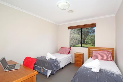 Katil atau katil-katil dalam bilik di Amberoo Apartments Tamworth