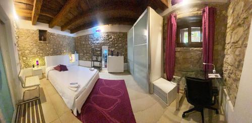 a large bathroom with a tub and a shower at La Casetta non è soltanto un alloggio, è storia! in Trentinara