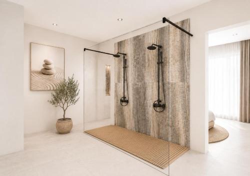 a shower with a glass door in a bathroom at BLACK AMBER BOUTIQUE HOTEL in Lampi