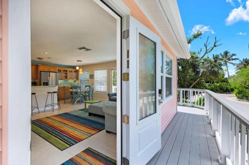 a porch with a view of a living room and kitchen at Pink Shell Sanibel in Sanibel