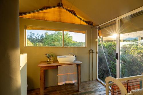 a bathroom with a sink and a window at Reflections Eco-Reserve in Wilderness