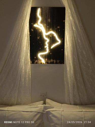 a bedroom with a bed with a white canopy at GIATRELOS HOUSE "near the shipwreck Zakynthos" in Volímai