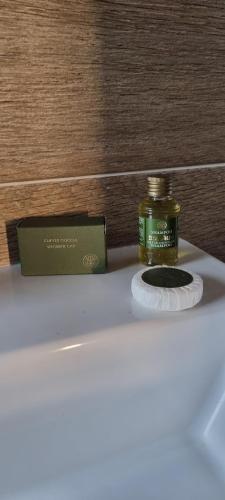 a bottle of essential oil sitting on top of a counter at Antico Borgo B&B Seggiano in Seggiano