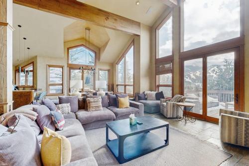 a living room with a couch and a table at The Gold Flake Chalet in Breckenridge