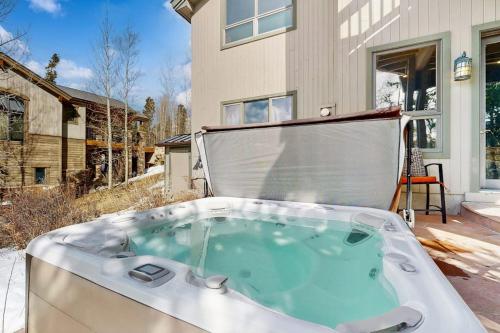 a hot tub in the backyard of a house at The Gold Flake Chalet in Breckenridge