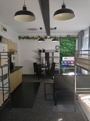 a room with a table and a dining room at Apartament Pod Kukułką PARKING FREE in Kłodzko