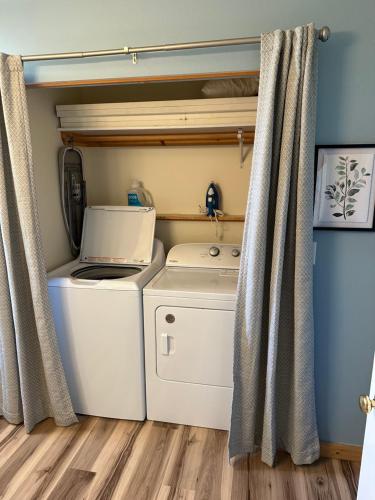 a laundry room with a washer and dryer at YellowstoneMigrant in Emigrant