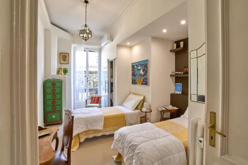 a bedroom with two beds and a window at A Casa Armenia B&B in Turin