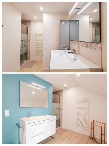 a bathroom with a white sink and a mirror at Gîte Les Chaumes in Orsennes