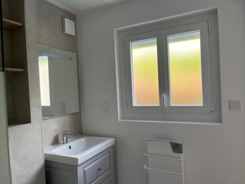 a white bathroom with a sink and a mirror at Villa de charme jardin vue sur montagnes rénovation 2026 in Argelès-Gazost