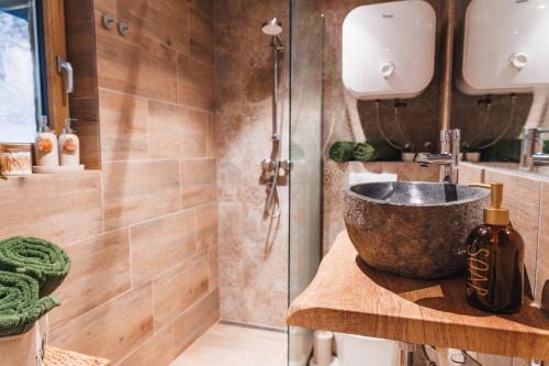 a bathroom with a sink and a shower at The Nook - Sauna, Pool, Ice Bath in Celje
