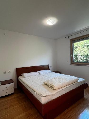 a bedroom with a large bed with a window at Villa Aria in Marčana