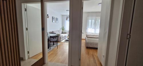 a living room with a view of a living room at Apartman A&V in Banja Luka