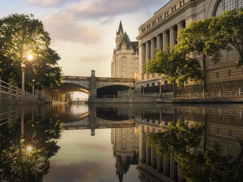 a bridge over a river in a city at Fairmont Chateau Laurier in Ottawa