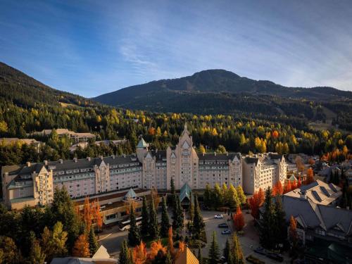 an aerial view of a town with trees and buildings at Fairmont Chateau Whistler in Whistler