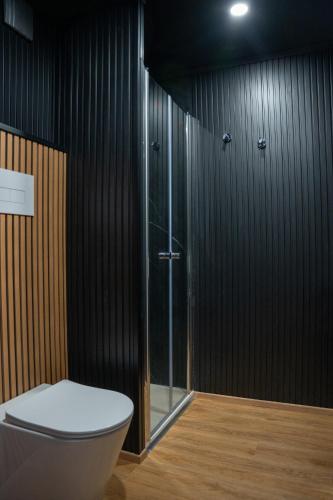 a bathroom with a toilet and a shower at House Boat Cervia in Cervia