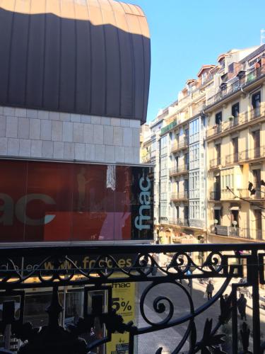 a view of a city with buildings and a fence at Pensión La Perla in Donostia-San Sebastián