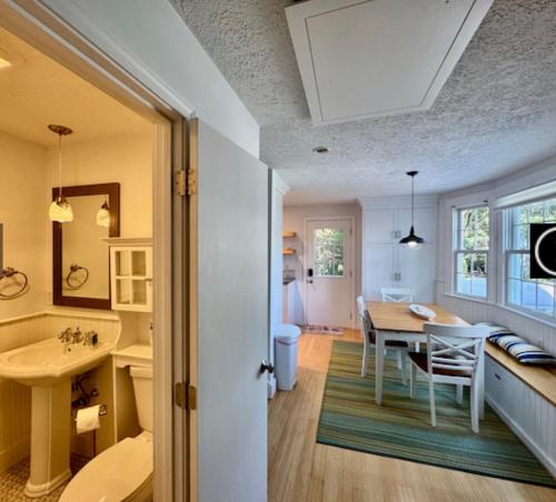 a kitchen and dining room with a table and a dining room at Katama Family Fun in Edgartown