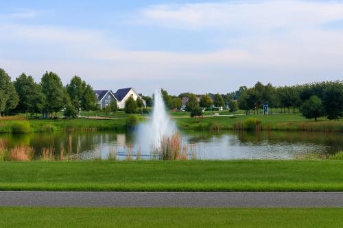 a pond with a fountain in the middle of a park at Spacious Family Gathering Space Privacy Zones Quiet, Convenient Neighborhood in Middletown