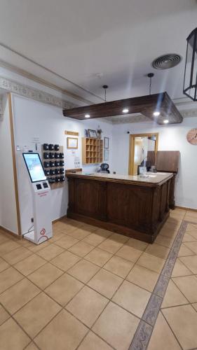 a room with a counter and a tasting room at Hostal Maria Ronda in Madrid